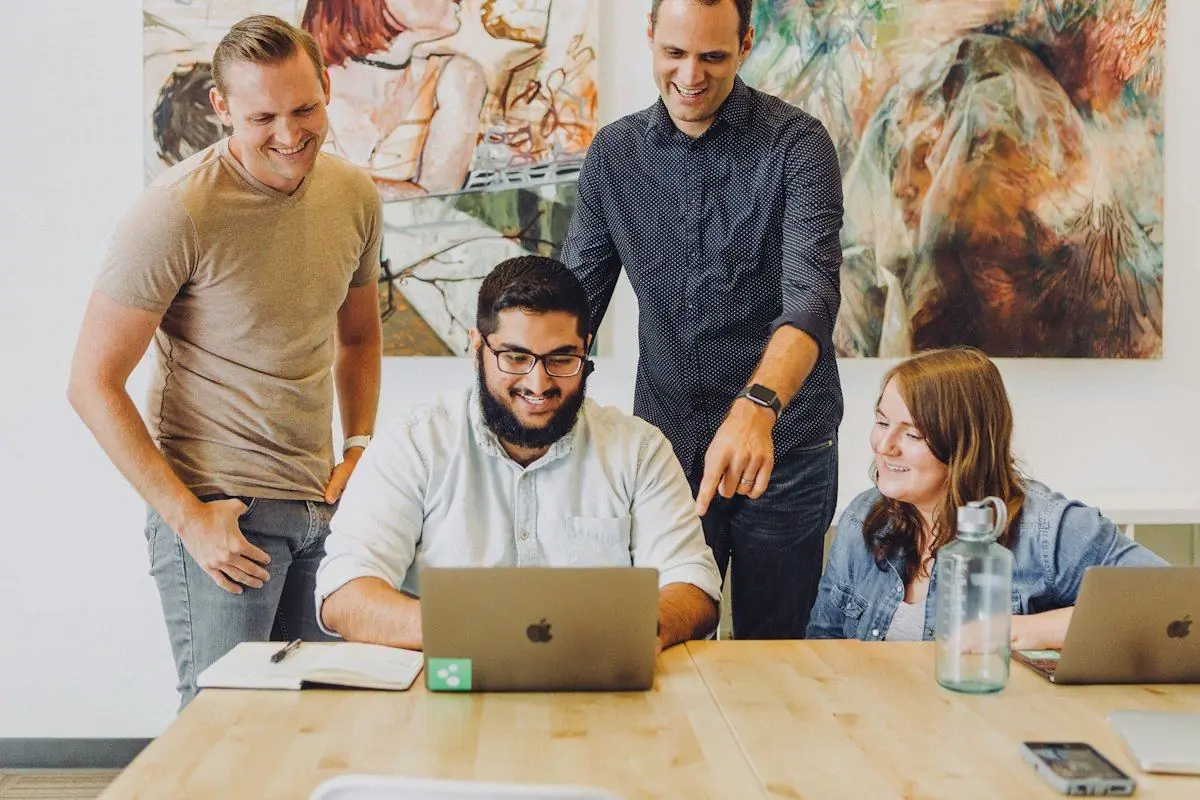 Team reviewing insights on a laptop